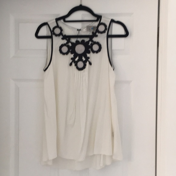 BCBGMaxAzria Tops - Sleeveless high low top , egg shell color, black